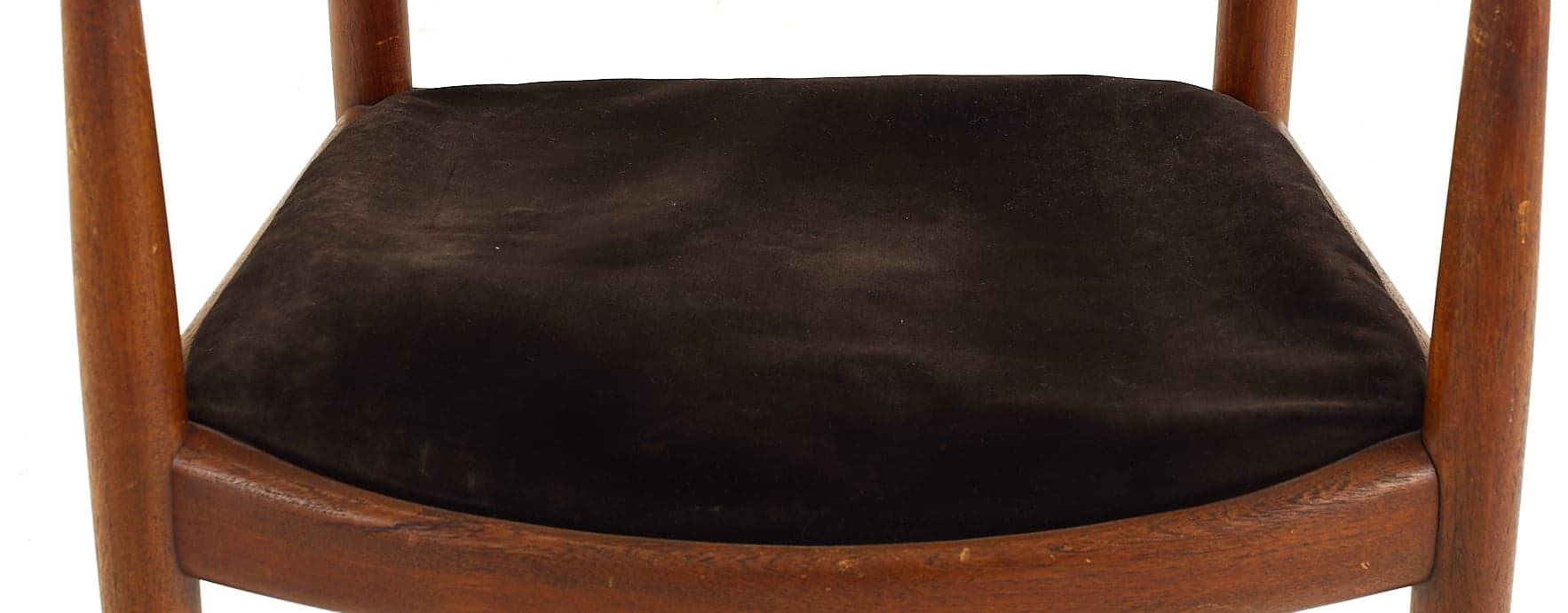 Black upholstered seat on Hans Wegner The Chair