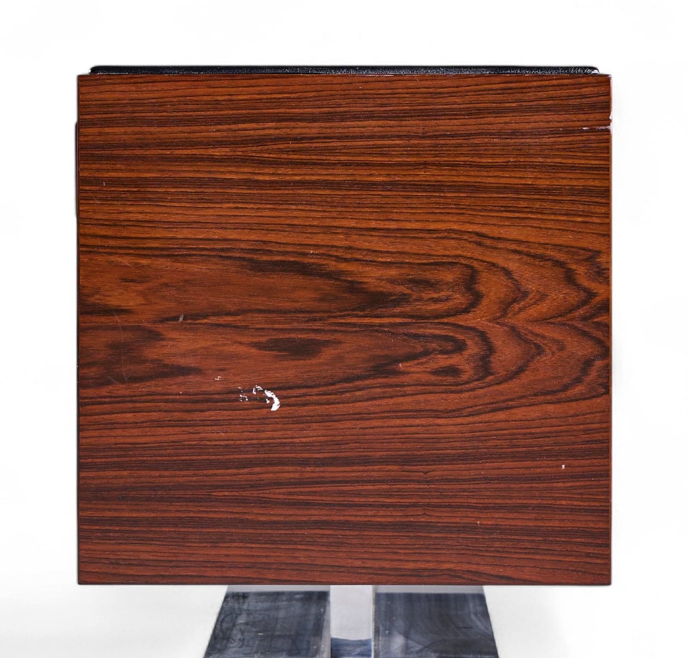 Distinctive rosewood grain pattern on side panel of Warren Platner credenza